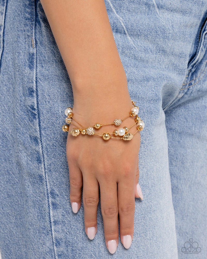 Classy Cruise - Gold Bracelet - Paparazzi Accessories