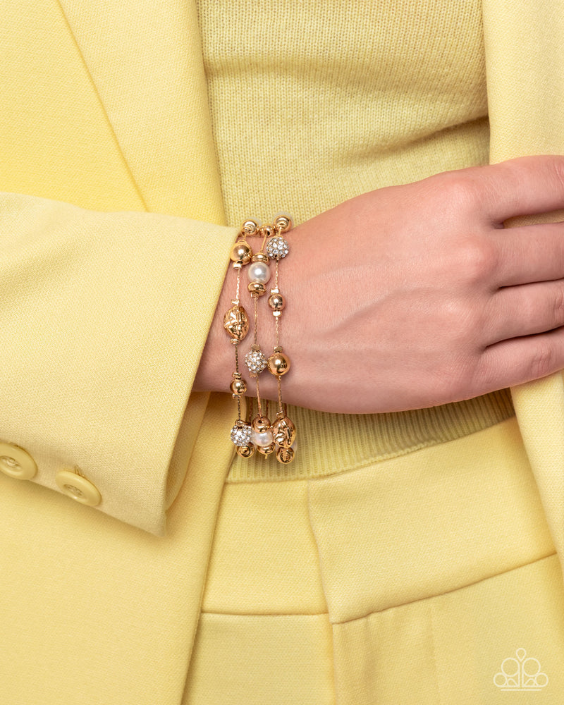 Classy Cruise - Gold Bracelet - Paparazzi Accessories