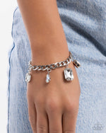 Driving Dazzle - White Bracelet - Paparazzi Accessories